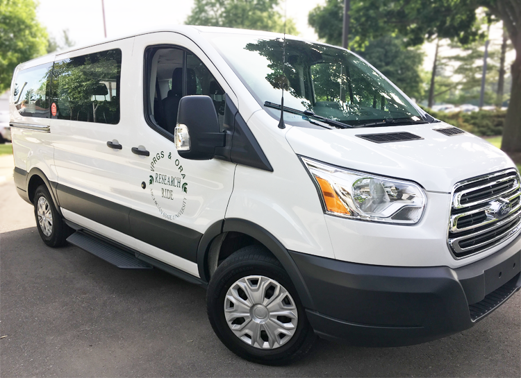 Photo of white van with research ride logo