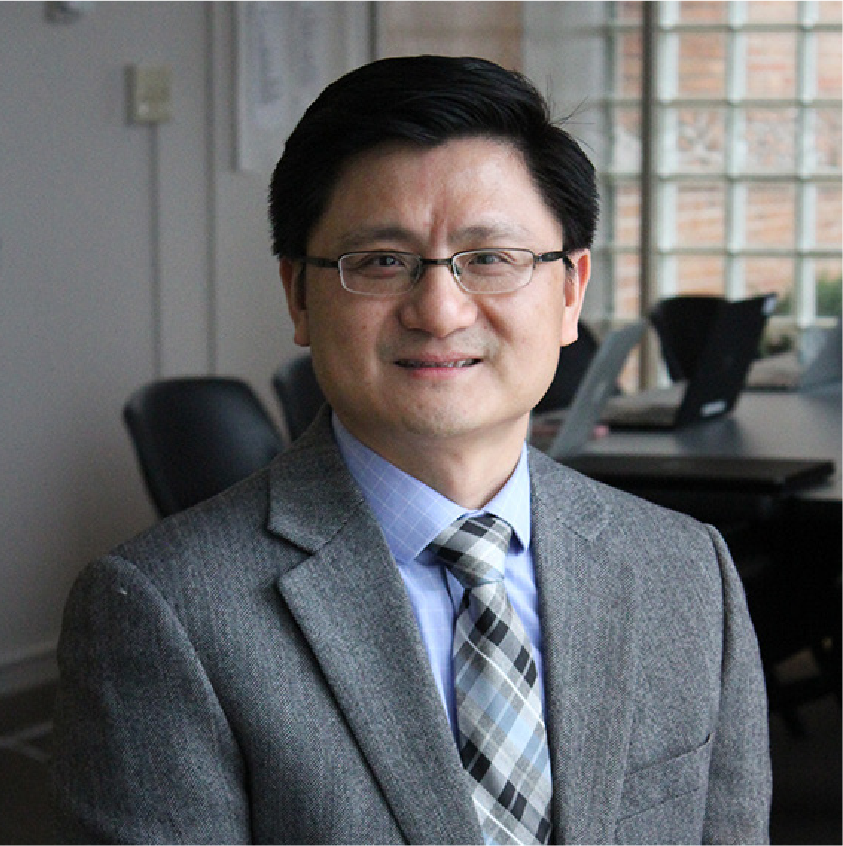 Kui Xie, a man with dark hair, glasses, wearing a suit and tie
